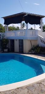 a swimming pool in front of a house at Villa Tropical, near beach, Cabarete, Caribbean in Cabarete