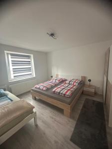 a bedroom with a bed and a window at Moderne 2,5 Zimmer Wohnung in Herne im Herzen des Ruhrgebiets in Herne