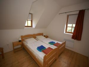 a bedroom with a bed with towels on it at Peaceful Mountain Holiday Stay in Stupná