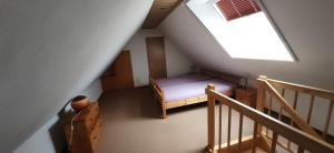 an overhead view of a room with a bed and stairs at 4 Sterne Ferien Martens in Cuxhaven