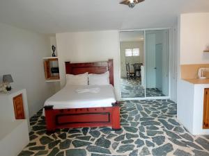 a bedroom with a bed and a large glass doorway at Villa Tropical, near beach, Cabarete, Caribbean in Cabarete +164 photos