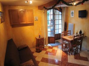 a kitchen with a table and a dining room at Cottage in Vaires-sur-Marne near Forest & Lake in Chelles