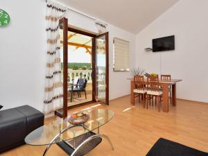 a living room with a glass table and a dining room at Holiday Home in Krusevo with Garden & BBQ in Kruševo +17 photos