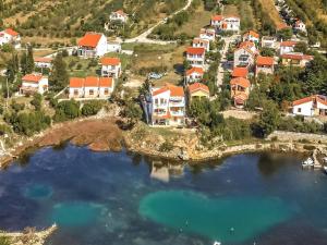 an aerial view of a house on a hill next to a lake at Holiday Home in Krusevo with Garden & BBQ in Kruševo