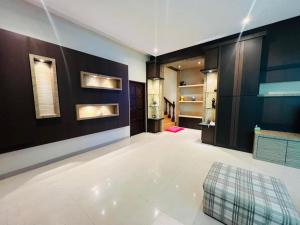 a living room with a large room with a couch at Exclusive Bungalow Private & Peaceful in Miri Ocean Park 5BR in Miri +58 photos