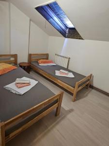 Ένα ή περισσότερα κρεβάτια σε δωμάτιο στο Idolina Apartment