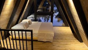 Кровать или кровати в номере Wooden Houses D&D
