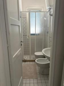 a bathroom with a shower and a toilet and a sink at Casa Libera in Savelletri di Fasano +42 photos