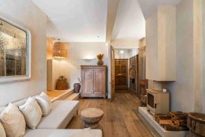 a living room with a white couch and a fireplace at Sanctuary House with Parking By My Getaways in Shoreham-by-Sea +34 photos
