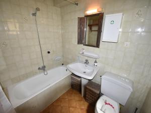 a bathroom with a tub and a sink and a toilet at Coastal Villa Near Beaches in Moraira