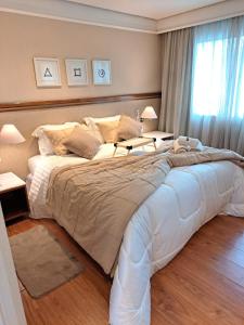 Ένα ή περισσότερα κρεβάτια σε δωμάτιο στο Conforto Flat Hotel Vila Olimpia +18 φωτογραφίες