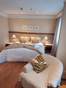 Ένα ή περισσότερα κρεβάτια σε δωμάτιο στο Conforto Flat Hotel Vila Olimpia