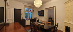 a kitchen and dining room with a table and chairs at Balatonka Apartman in Alsóörs
