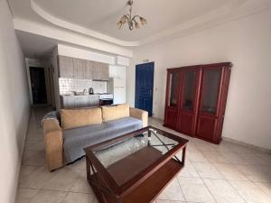 a living room with a couch and a coffee table at PORT MARIN a in Livadi
