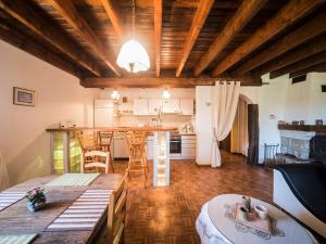 a kitchen and living room with a table and chairs at Apartment in Darney with Meadow Views in Dombasle-devant-Darney