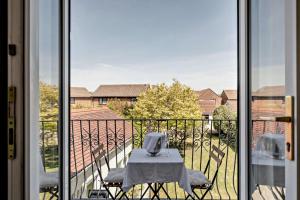 a table and chairs on a balcony with a view at Avalon in Nottage