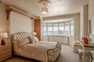 a bedroom with a large bed and a window at Avalon in Nottage