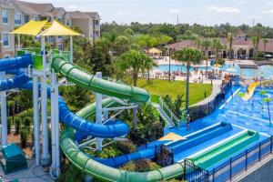 a water park at a resort with a water slide at 3 Bedroom Condo with Water Park & Fantastic Pool only Minutes To Walt Disney World's Front Gate!!! in Orlando