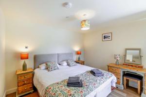 Ένα ή περισσότερα κρεβάτια σε δωμάτιο στο Y Bwthyn Y Berwyn +28 φωτογραφίες