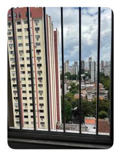 a view of a city from a window at Quarto em área nobre central da cidade in Belém