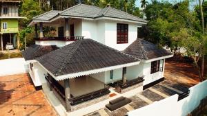 an overhead view of a house with a roof at Tranquil Nest Villa - 4BHK Villa - Entire Villa stay in Wayanad in Kalpetta