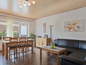 a living room with a couch and a table at Entspannender Rückzugsort in Langewiese in Winterberg