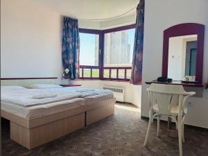 Кровать или кровати в номере Reduta - economy rooms