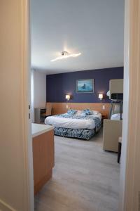 Postel nebo postele na pokoji v ubytování Hotel De La Mer