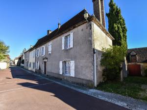 an old house on the side of a street at Vintage Retreat in Montfaucon in Montfaucon