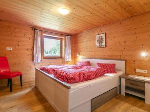 a bedroom with a bed in a wooden cabin at Am Bauernhof Top 1 in Alpbach
