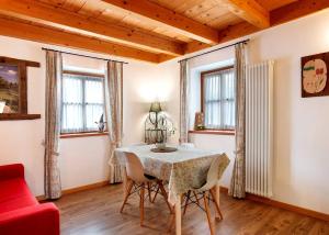 a dining room with a table and chairs at Chalet Dolomiti Trentino in Sant’Orsola +33 photos