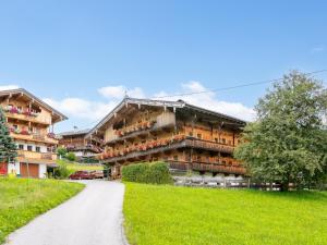 a large apartment building with a road in front of it at Am Bauernhof Top 2 in Alpbach