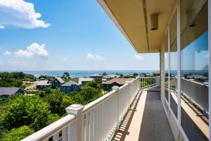 a balcony with a view of the city at DK290 Point of View in Duck