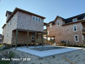 a house under construction with a patio in front of it at NH369 Nags Head 369 in Nags Head