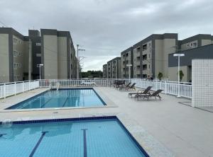 a large swimming pool on a building with buildings at AP a 3KM das PRAIAS, com SUÍTE in São Luís
