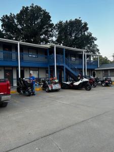 a group of motorcycles parked in front of a building at Viking Motel in Lindsborg