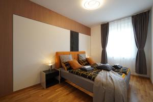 Ένα ή περισσότερα κρεβάτια σε δωμάτιο στο KEDA Royale Suite City Center Charm