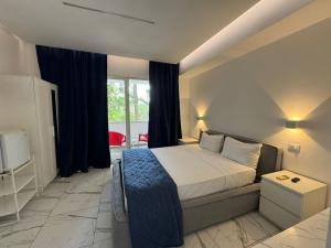 a hotel room with a bed and a window at Boca Beach Residence hotel in Boca Chica +49 photos