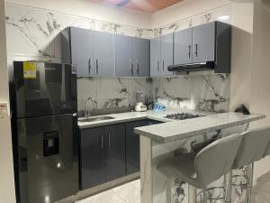 Kuchyň nebo kuchyňský kout v ubytování excelente apartamento en Alvarado Tolima + 11 fotografií