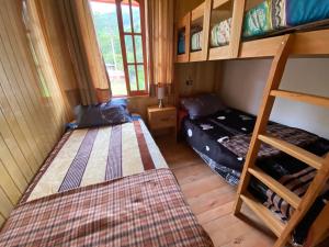 a small room with two bunk beds and a bed at Cabañas Don Ceferino in Palmira