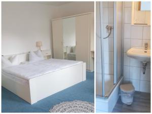 a bedroom with a white bed and a sink at Hotel mit Gasthof zur Post in Hochkirch