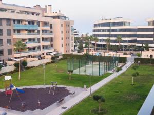an aerial view of a park with a playground at Los Alamos Breeze - Modern Beach Apartment in Torremolinos