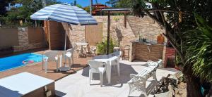 Πισίνα στο ή κοντά στο Ótima casa de praia com piscina +52 φωτογραφίες