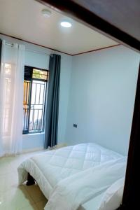 Ένα ή περισσότερα κρεβάτια σε δωμάτιο στο Eden Apartments