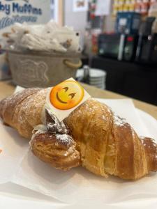 a croissant with an egg on top on a table at Antico Palazzo in Salerno +33 photos