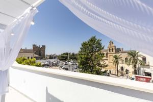 a view of a city from a balcony at Suite Piazza Vittorio Emanuele in Mesagne