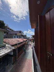 a view of a street in a city with buildings at Casas Oba in Morro de São Paulo