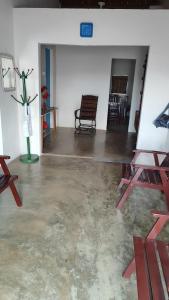 an empty room with a chair and a vase in it at Casa Menezes - Ilha do Ferro - Alagoas in Pão de Açúcar