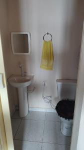 a small bathroom with a sink and a toilet at Casa Menezes - Ilha do Ferro - Alagoas in Pão de Açúcar