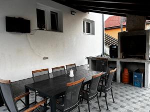 a black table and chairs on a patio at Kraljev Vrh Apartments in Kraljev Vrh